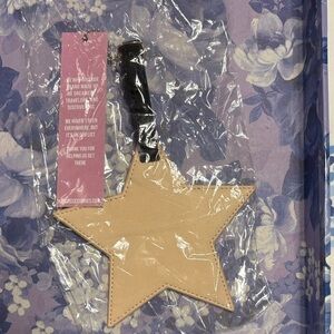 Tan Star-Shaped Luggage Tag with Black Strap